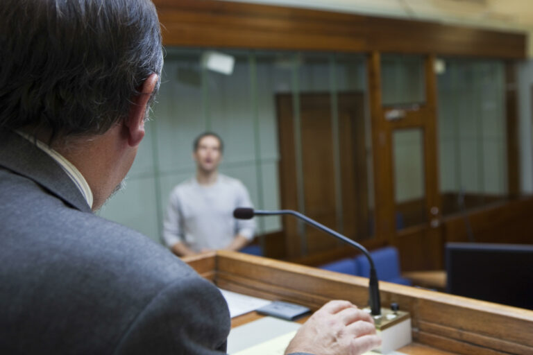 In a British magistrates court in England, models pose as defendant and Judge.