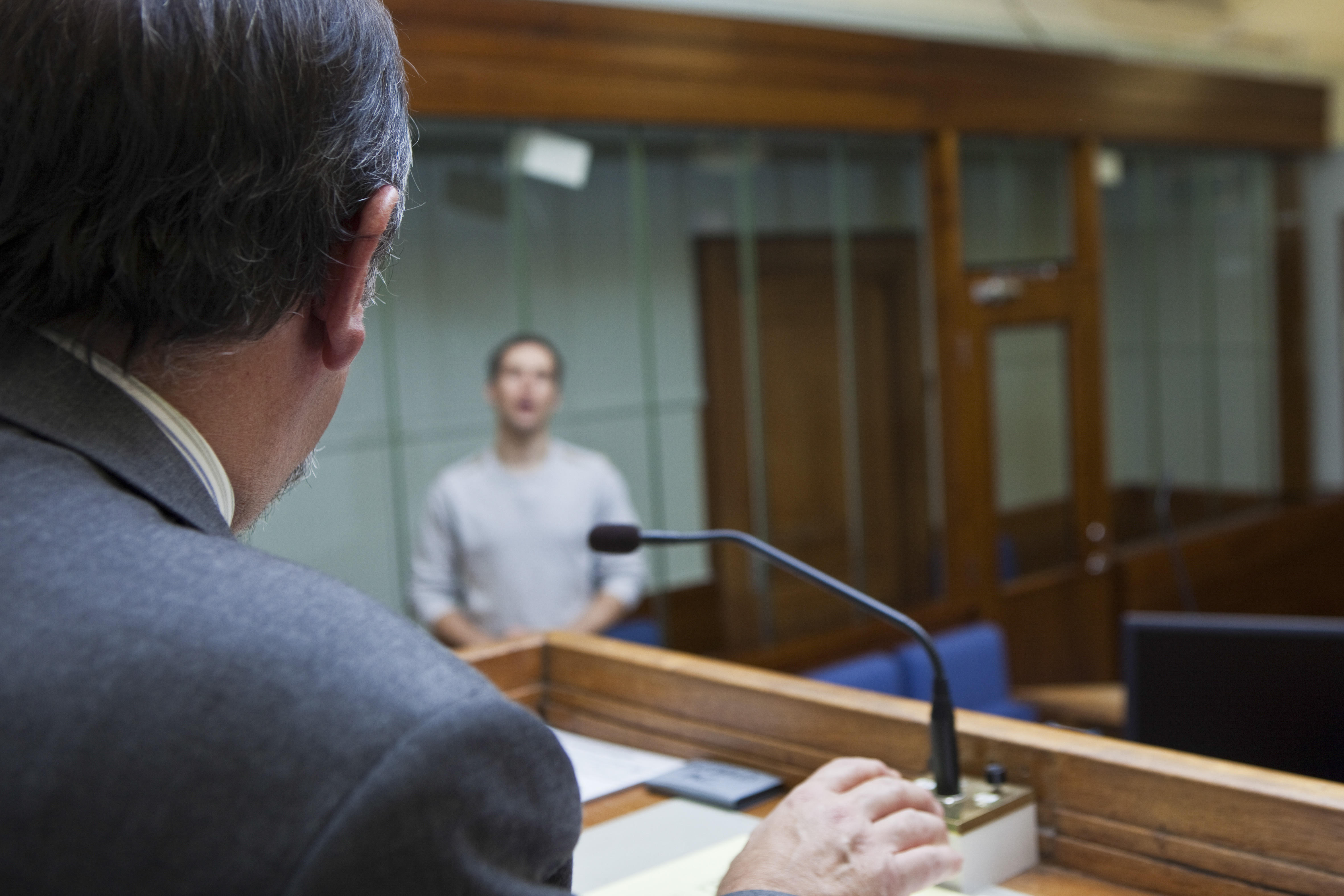 In a British magistrates court in England, models pose as defendant and Judge.